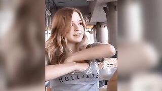 Public Flashing: A cute redhead flashing her breasts in public