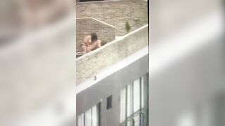gals pumping on a balcony