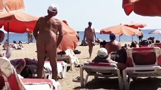 nude beachgoer packing some serious stovepipe