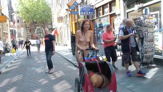just a stripped cutie pushing a bulldog in a stroller in Chinatown