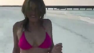 Hardcore: Elizabeth Hurley dancing on the beach at sunset