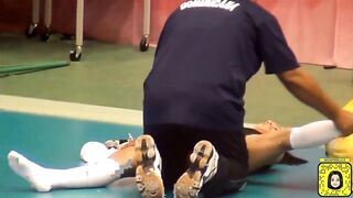 Winifer Fernandez gets some help stretching