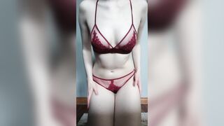 Some dark red lingerie and some pale, squishy tits ??