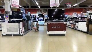 pissing on a television in a store - Pee