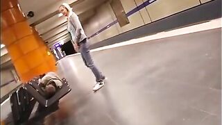 Girl pees next to a sleeping guy in a train station - Pee