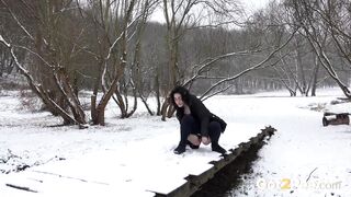 European dark haired cutie melting the snow with her warm pee